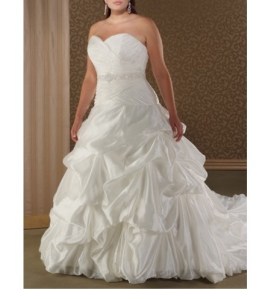 On this ball gown the waist is brought a little further down on the dress. This cut is referred to as the "natural waistline". The natural waistlines shows off more of your waist and causes your torso to look longer and leaner.